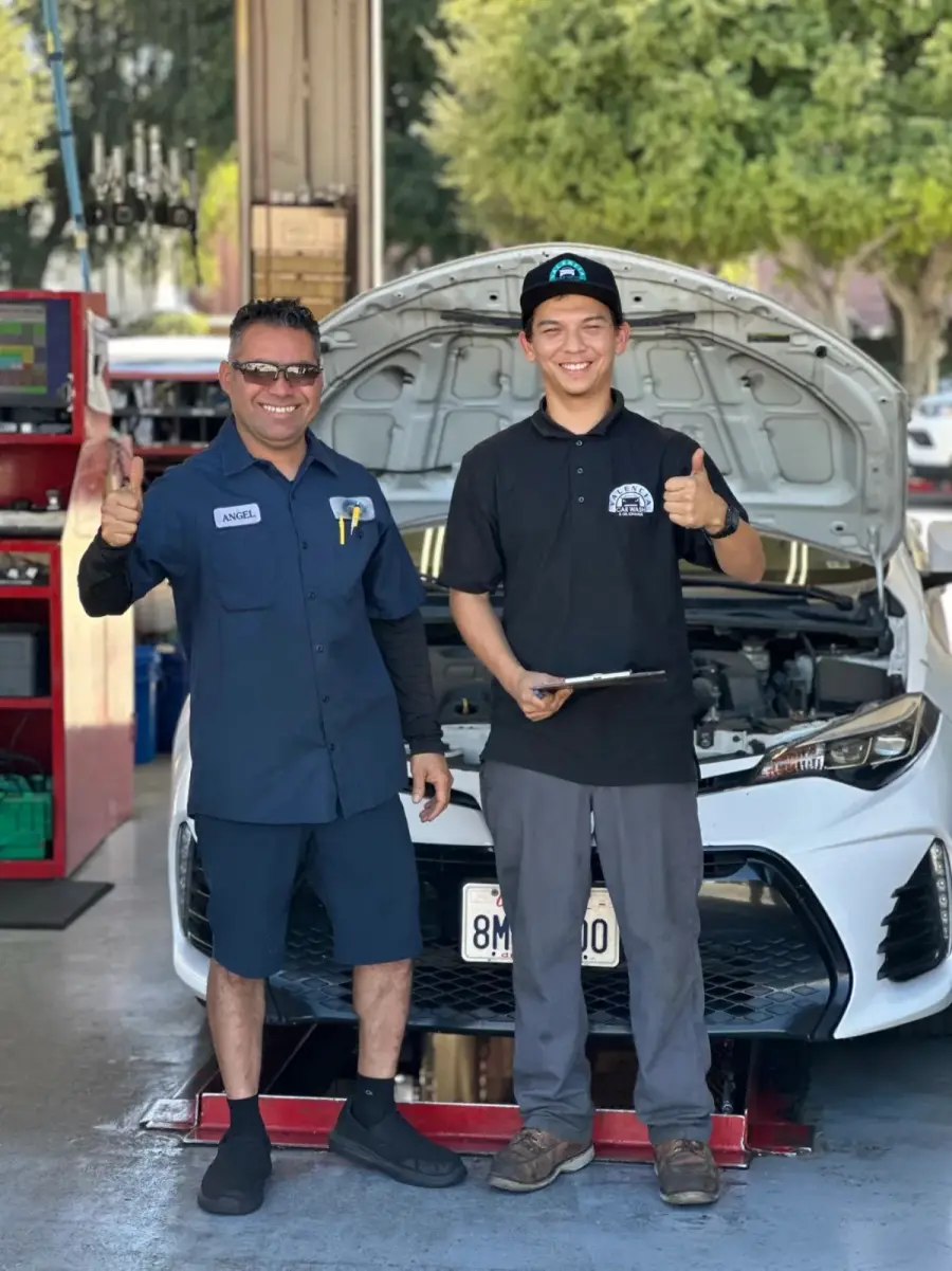 Technician changing engine oil at Valencia Car Wash